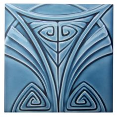 a blue tile with an intricate design on it