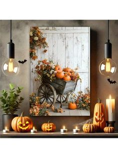 pumpkins in a wheelbarrow on a table with candles and lights around it