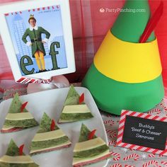 elf themed desserts are displayed on a table