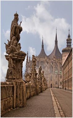 an image of a city street with statues