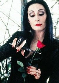 a woman with long black hair holding a rose