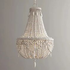 a white chandelier hanging from the ceiling