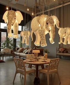 an elephant themed chandelier hangs from the ceiling