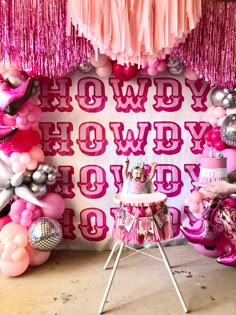 a pink and silver birthday party with decorations