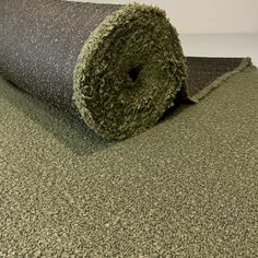 a roll of carpet sitting on top of a floor