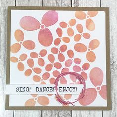 a handmade card with pink and orange circles on it, saying sing dance enjoy