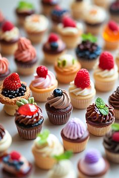 there are many cupcakes with different toppings on them