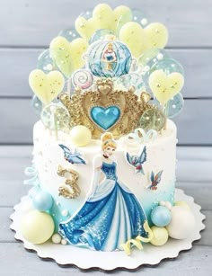 there is a cake decorated with princesses and balloons