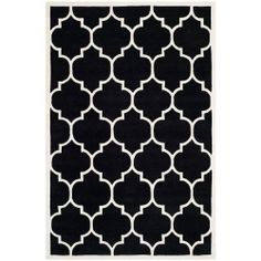 a black and white rug with an intricate design