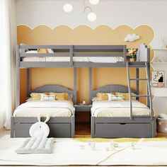 two children's bunk beds in a room with yellow walls and white rugs