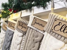 stockings hanging from hooks with name tags on them