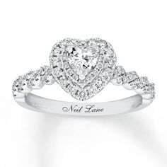 a heart shaped diamond ring with the name neil lane written on it