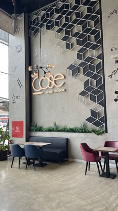 the inside of a restaurant with tables and chairs