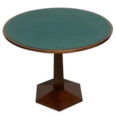 a round wooden table with a green glass top on an octagonal base, against a white background