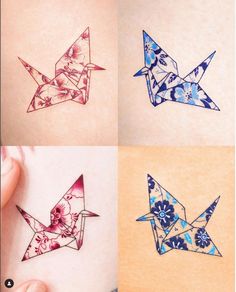 four different types of origami birds on the back of someone's stomach