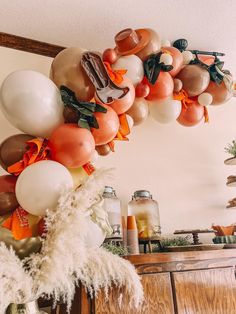 a bunch of balloons hanging from the ceiling