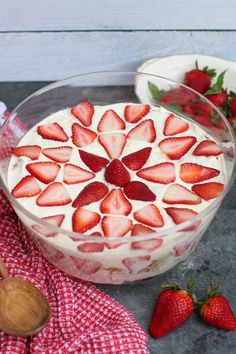 a dessert dish with strawberries in it