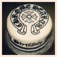 a white cake with black lettering on it