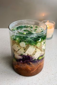 a jar filled with food sitting on top of a table