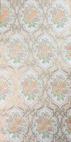 an old wallpaper with flowers and leaves in pastel colors on white background, closeup