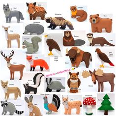 many different types and sizes of animals made out of clay or paper with words on them