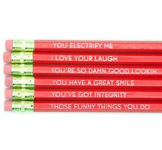 four red pencils with words on them