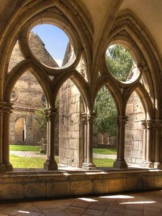 an old building with arches and stone floors