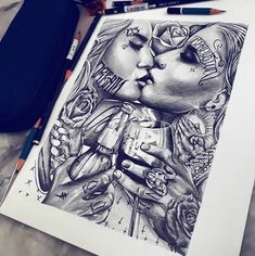 a drawing of two people kissing each other with pencils on the table next to them