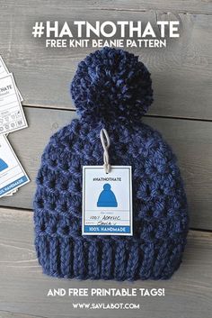 a blue knitted hat with a tag on it that says, free knit beanie pattern and printable tags