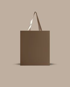 a brown shopping bag on a beige background