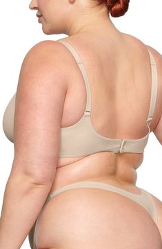 Enjoy the comfort of a bralette while retaining the support of an underwire with this comfortable everyday option. Available in many different shades, this second-skin bra is updated with a straighter, bonded neckline with no stitching to allow the 360º stretch fabric to lay flat against your skin. Adjustable straps 80% polyamide, 20% elastane Hand wash, dry flat Imported lined No-show Padded Bra, Solid Nursing Bra With Medium Bust Support, Shaping Bra With Medium Bust Support And No-show Design, Stretch Bra With Moderate Coverage, Medium Bust Support No-show Bra, Supportive Bra With Moderate Coverage, Supportive Underwire Bra In Beige, Full Coverage Bra With Adjustable Straps, Beige Underwire Bra With Removable Pads