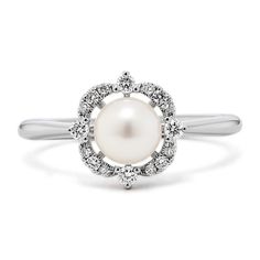 Sparkling and sophisticated  this ring features a cultured Akoya pearl surrounded by a scalloped halo of natural diamonds. It’s crafted in bright 14-karat white gold and makes a gorgeous daily accessory or June birthstone gift. White Gold Pearl Ring With Diamond Center Stone, Timeless White Gold Pearl Ring With Center Stone, Elegant Pearl Ring With Halo For Wedding, Formal Pearl Ring With Diamond Halo Design, Elegant Pearl Ring With Halo Design For Wedding, Elegant Wedding Pearl Ring With Halo Design, White Gold Pearl Ring With Center Stone, Round Cut, Elegant Pearl Promise Ring With Halo Setting, Wedding Pearl Ring With Diamond Halo