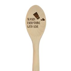 a wooden spoon with the words season everything with love on it