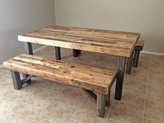 three wooden benches sitting on top of a tiled floor