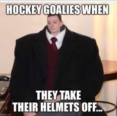 a man in a suit and tie sitting at a table with the caption hockey goalies when they take their helmets off