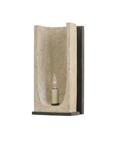 a wall mounted candle holder with a single lit candle