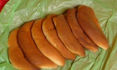 a bunch of bread slices sitting on top of a green wrapper