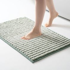 a person standing on top of a mat