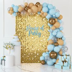 a blue and gold party theme with balloons