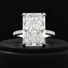 Embrace magnificence with our HUGE 9 Carat Radiant Cut Diamond Engagement Ring. Featuring a lab grown diamond pave band, this ring is perfect for weddings, proposals, and luxury anniversary gifts. Crafted with exquisite detail and elegance, it embodies timeless beauty and sophistication. Make a statement of enduring love with this stunning piece from Lux By Evara Jewelry. 𝐅𝐞𝐚𝐭𝐮𝐫𝐞𝐬:• 𝐌𝐚𝐝𝐞 𝐭𝐨 𝐎𝐫𝐝𝐞𝐫• 𝐌𝐞𝐭𝐚𝐥: 𝟏𝟒𝐊 𝐆𝐨𝐥𝐝 | 𝟏𝟖𝐊 𝐆𝐨𝐥𝐝 | 𝟗𝟓𝟎 𝐏𝐥𝐚𝐭𝐢𝐧𝐮𝐦• 𝐁𝐚𝐧? Luxury Radiant Cut Brilliant Diamond Rings, Exquisite Luxury Radiant Cut Diamond Ring, Luxury Radiant Cut Platinum Ring, Elegant Radiant Cut Gia Certified Ring, Luxury Rose Gold Radiant-cut Rings, Huge Engagement Rings, Radiant Cut Diamond Engagement Rings, Stacked Wedding Rings, Pave Diamond Band