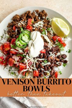 a white plate topped with beans, rice and veggies