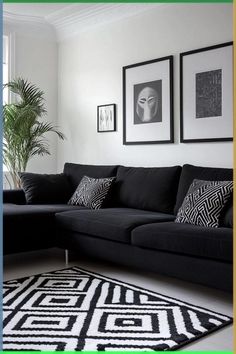 a black and white living room with pictures hanging on the wall above the couches