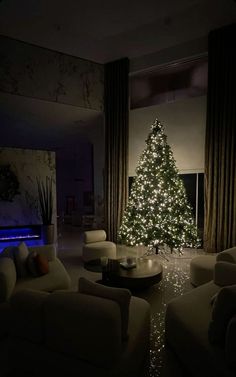 a living room filled with furniture and a christmas tree