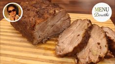 sliced meat sitting on top of a wooden cutting board next to a woman's face