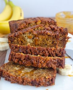 sliced banana bread sitting on top of a white plate