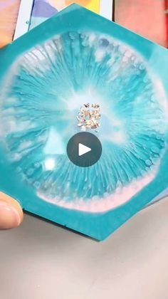 someone is holding up a card with an eyeball in it's center and the video below