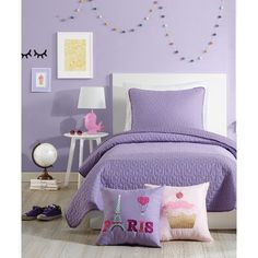 a bedroom with purple walls and white furniture