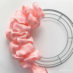 a pink scrunffle on a wire wreath