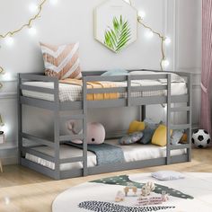 there is a bunk bed with two sets of beds on top of it in the room