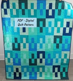 a blue and green quilt with the words pdf - digital quilt pattern on it